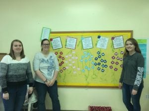 BECA and their bulletin board, with gift suggestions for the family they have adopted for the holidays