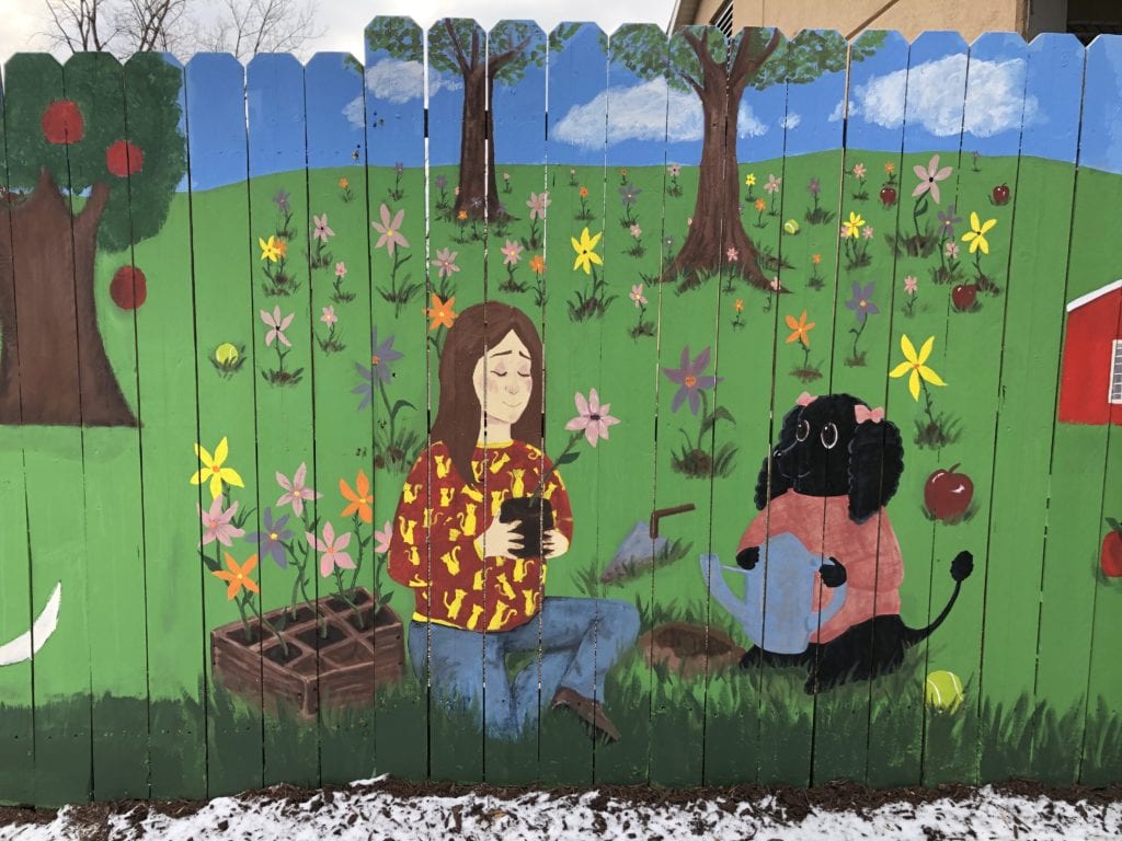 A panel from the mural SUNY Broome students painted on the Broome County Dog Shelter fence.