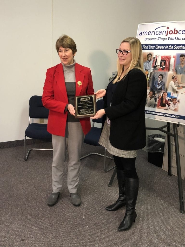 SUNY Broome Continuing Education and Workforce Development Director Janet Hertzog presents the CEANY award to Broome-Tioga Workforce Director Sara Liu