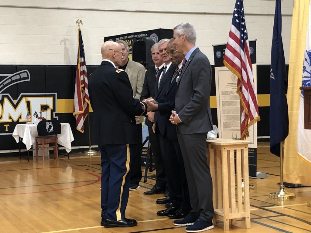 Col. Ben Margolius receives his pin from Major General Arnold Fields.
