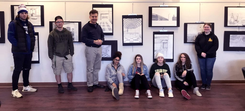 Professor Hall Groat and VisComm students with their artwork on display in the Gallery