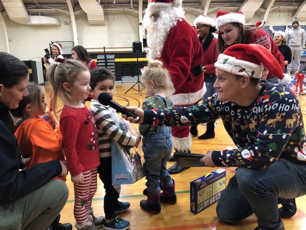 Student Activities Director Jason Boring chats with the childrne of BC Center during the Giving of the Toys on Dec. 5, 2019.