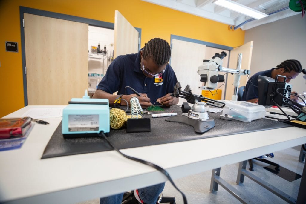 A student in the soldering lab at the Calice Advanced Manufacturing Center