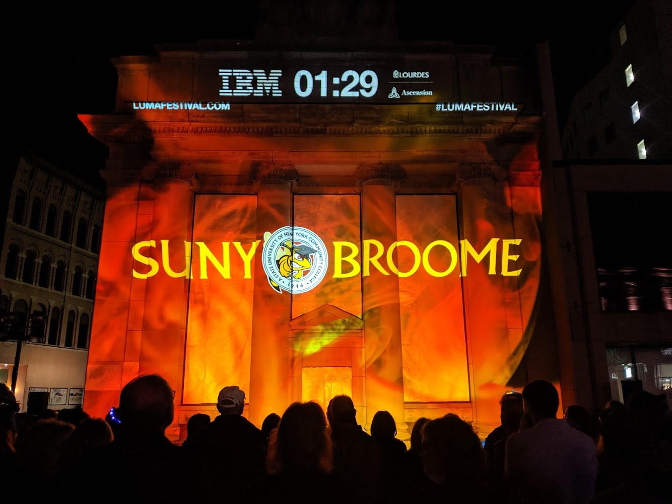 Illuminated SUNY Broome logo at LUMA festival