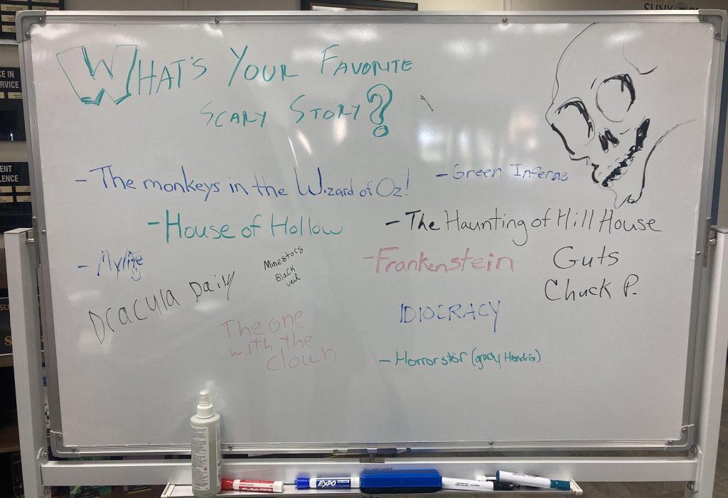 Library's mobile white board with What is your favorite Scary Story?