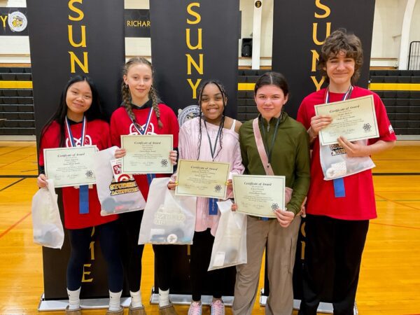 Five students hold their awards from the science fair.