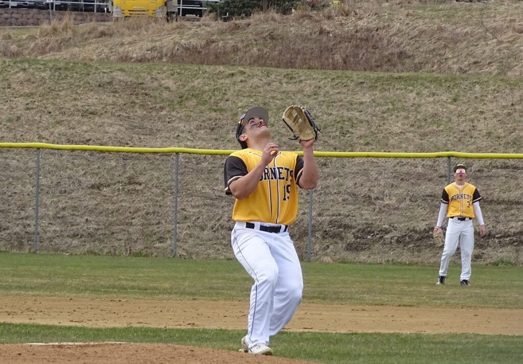 SUNY Broome's Nick Ragonese eyes and glove up to catch the ball.