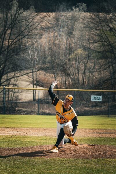 SUNY Broome Men's baseball. Pitcher Jacob McTigue in mid-pitch