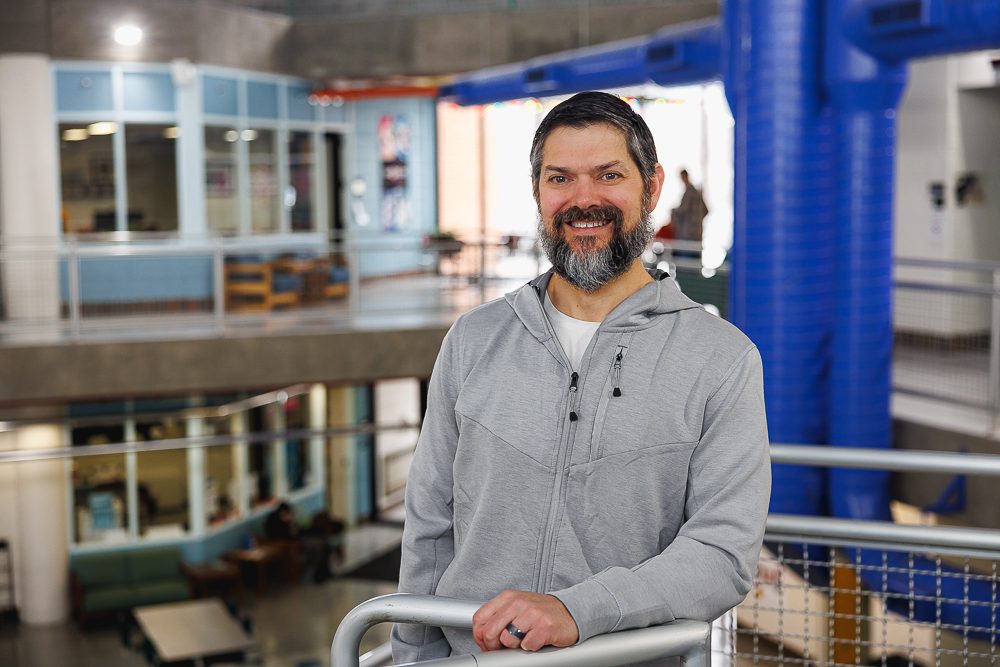 Professor Rich Zwolinski stands in the AT atrium. 