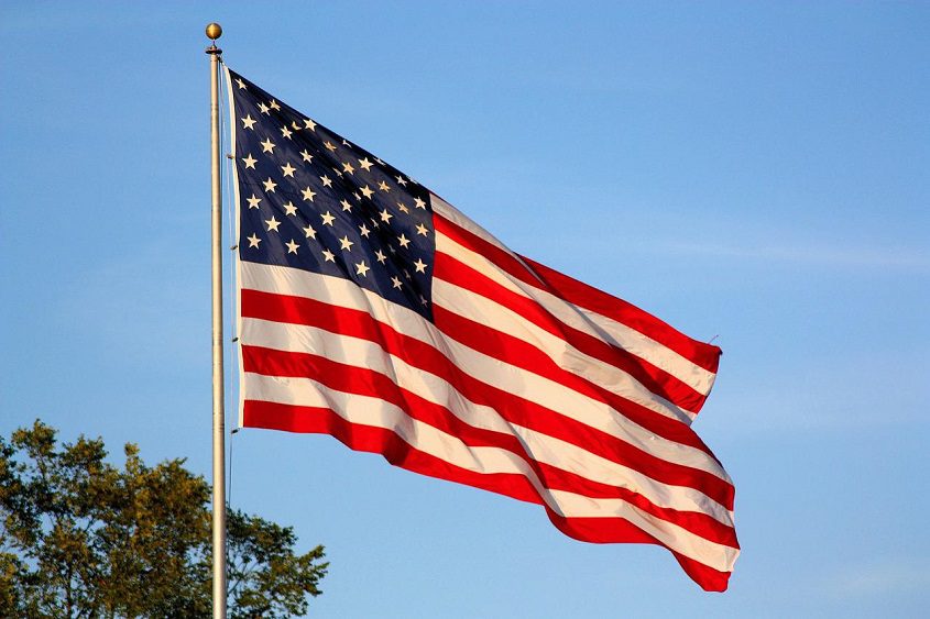American flag flying against a blue sky