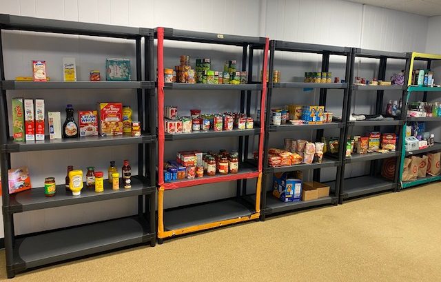 Food pantry shelves partially filled
