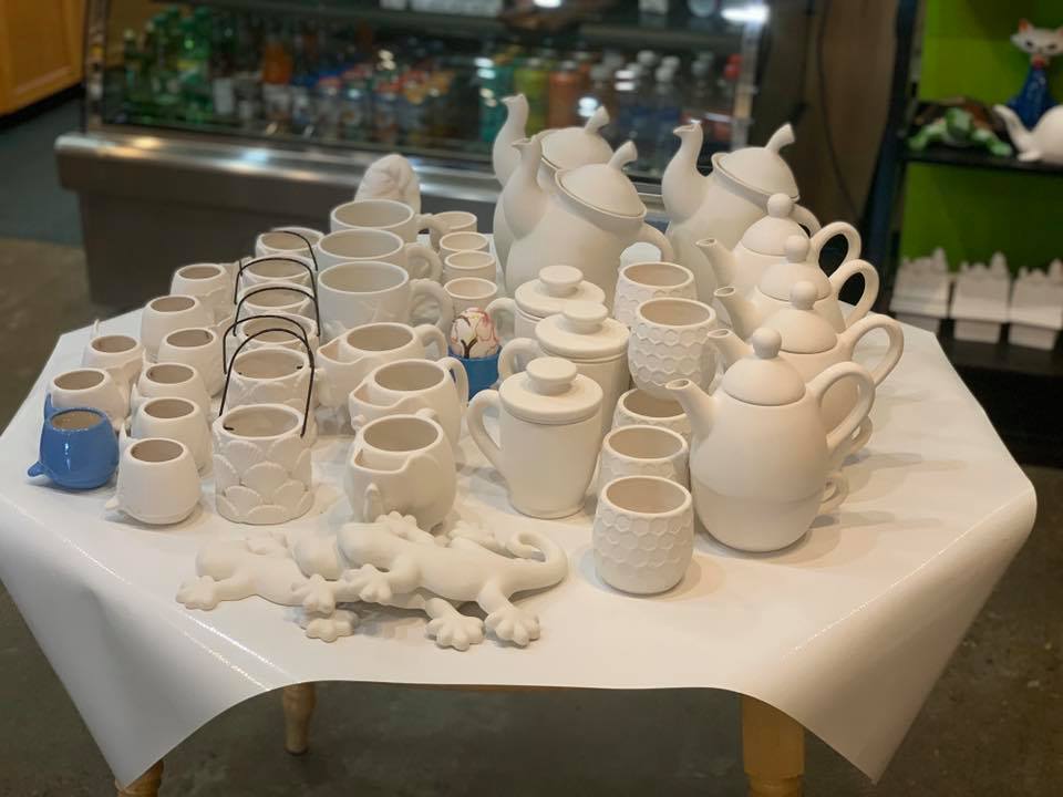 plain white pottery items waiting to be painted